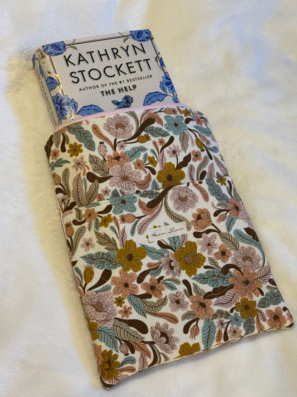 Folk Floral Tablet Sleeve exterior flat lay showing full cream botanical print with front pocket