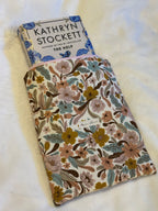 Folk Floral Tablet Sleeve exterior flat lay showing full cream botanical print with front pocket