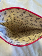 In the Garden Paperback Sleeve interior showing charming bee print lining and pink zipper