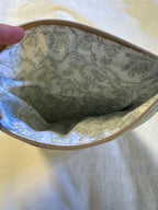Mossy Mushroom Kindle Sleeve interior showing delicate sage floral lining and gold zipper
