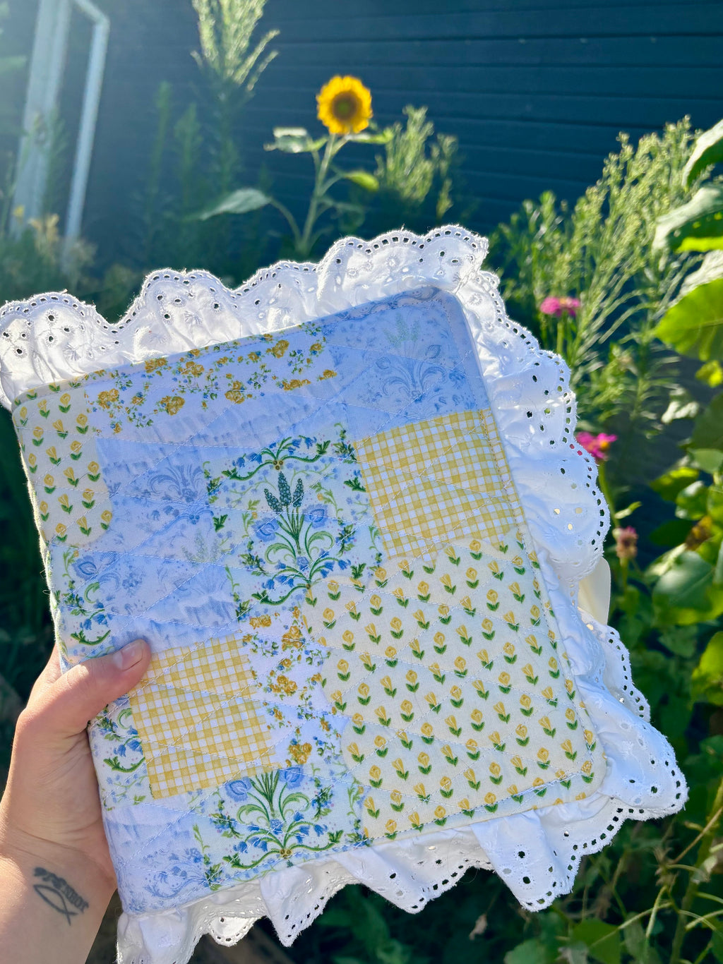 Custom quilted Bible cover with yellow tulip and blue bluebell patchwork with lace trim