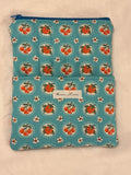 Sweet Cherry Pie Blue Kindle Sleeve exterior in sky blue strawberry and cherry print with front pocket and size comparison
