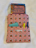 Sweet Cherry Pie Pink Kindle Sleeve exterior in pink strawberry and cherry print with front pocket holding sticky notes and pens