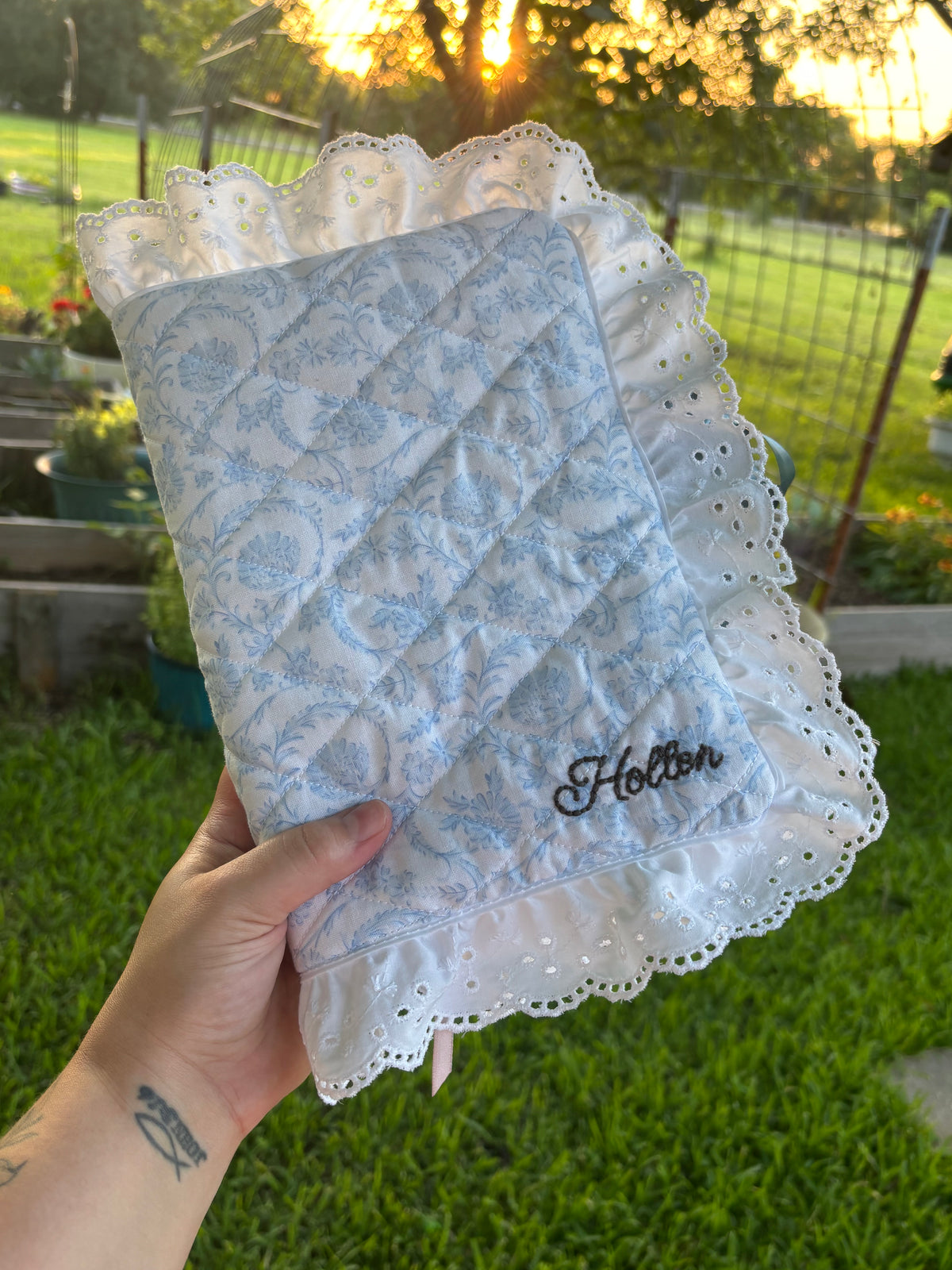 Custom quilted Bible cover with blue floral toile and Holton family name embroidery