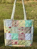 Cottage Patchwork Tote interior showing charming bee-print lining and interior pocket