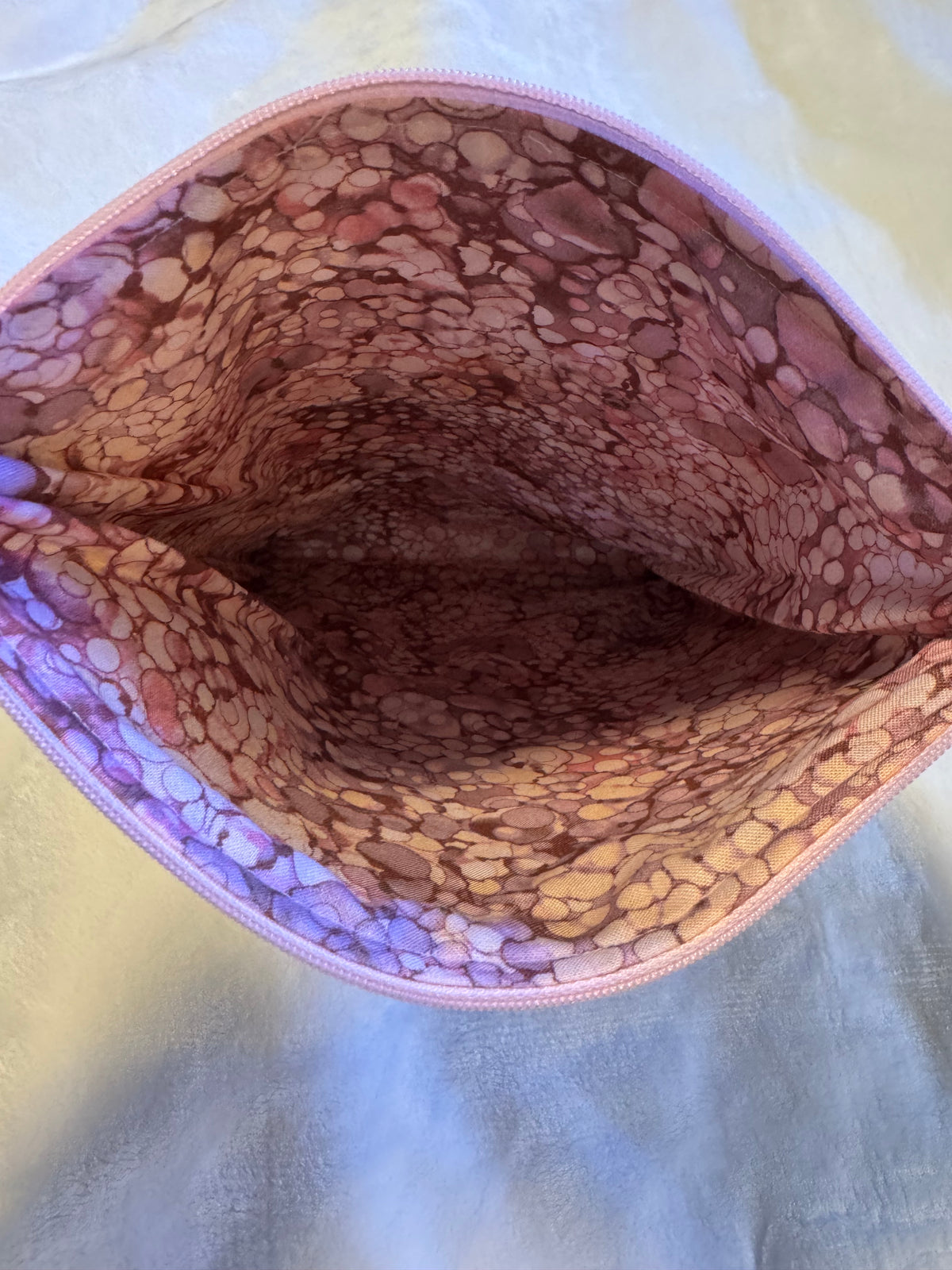 Folk Floral Tablet Sleeve interior showing marbled pink and purple lining with blush zipper