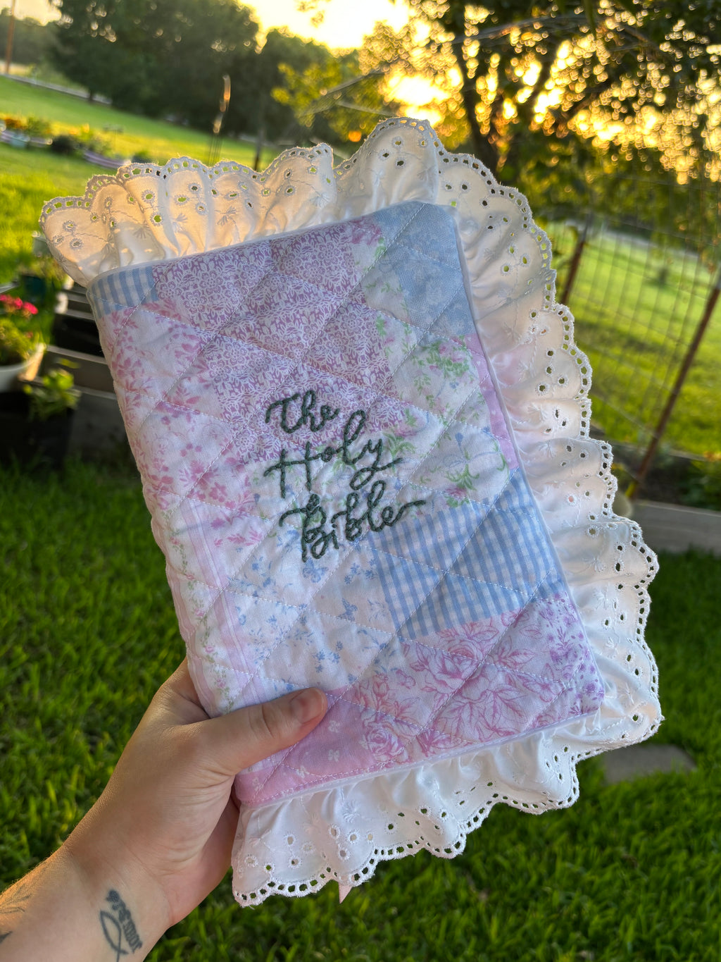 Custom quilted Bible cover with lavender patchwork and The Holy Bible embroidery with lace trim