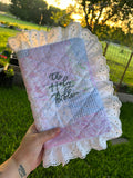 Custom quilted Bible cover with lavender patchwork and The Holy Bible embroidery with lace trim