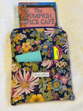 Midnight Garden Kindle Sleeve exterior in rich navy floral print with front pocket holding sticky notes and pens