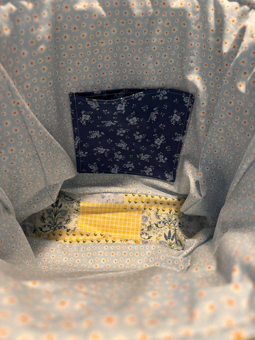 Something Blue Purse side view showing 4¼" depth and double handles